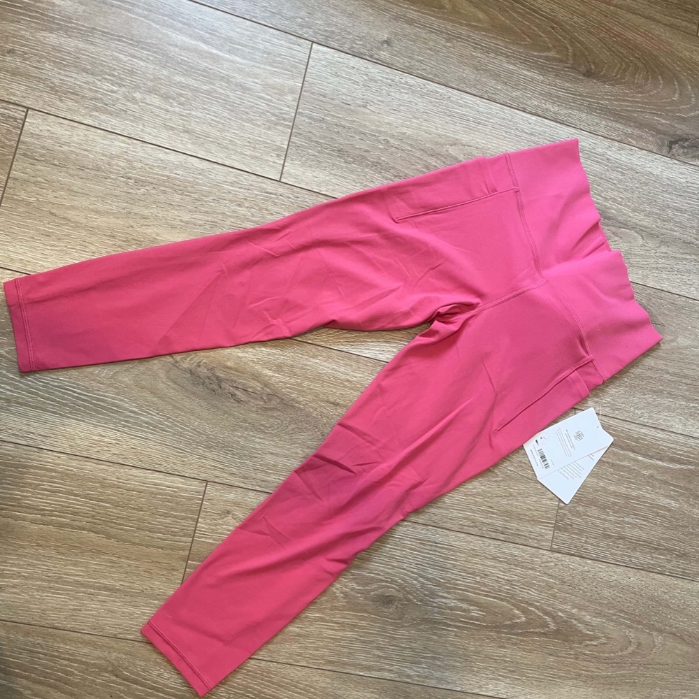 Athleta Salutation Stash pocket II 7/8 tight